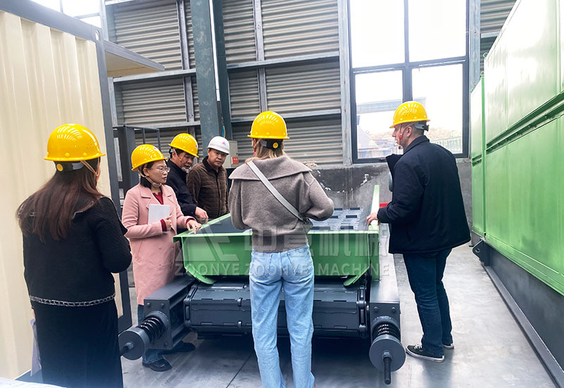 Technical manager explains equipment to customers